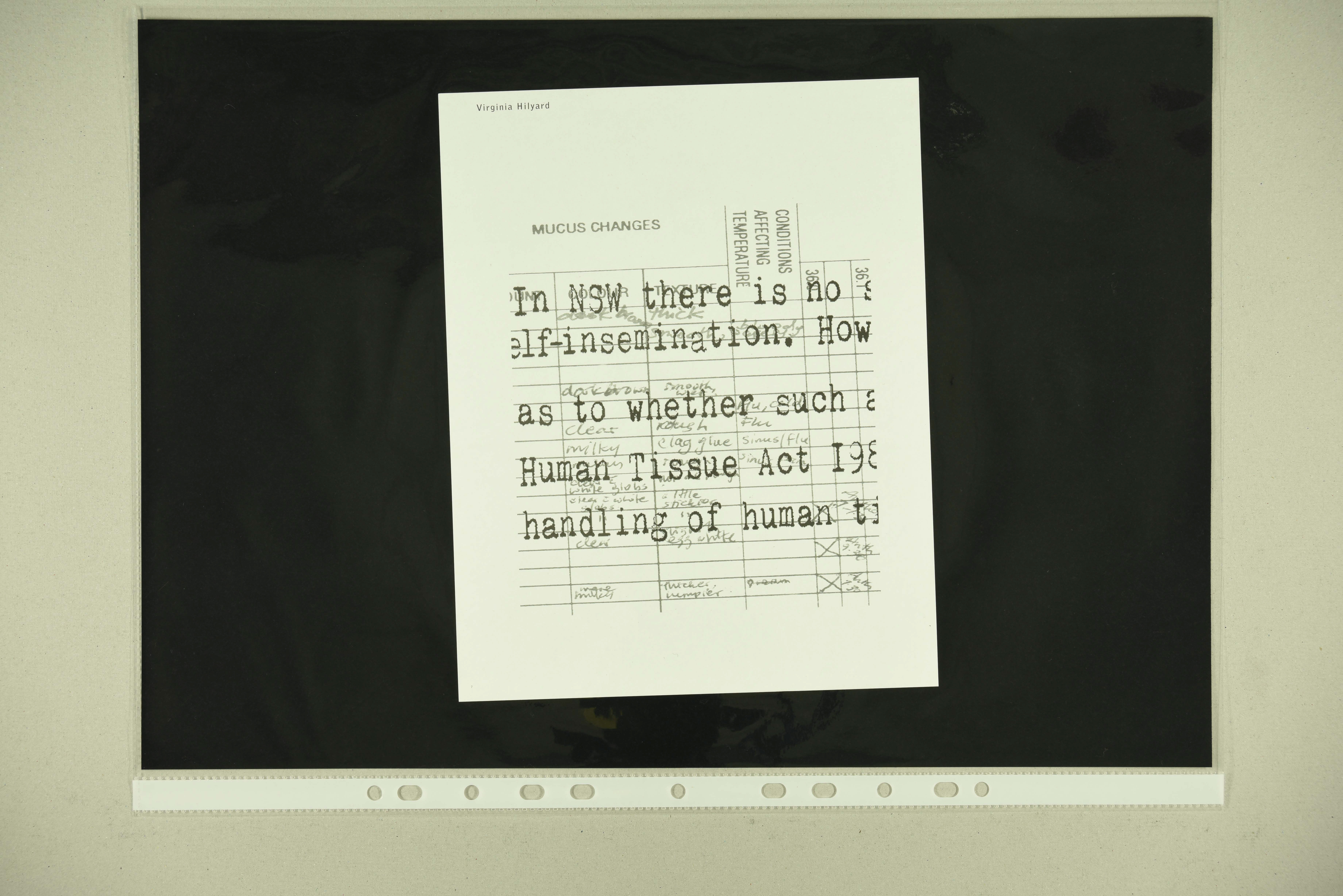 Piece of paper in plastic sleeve containing text