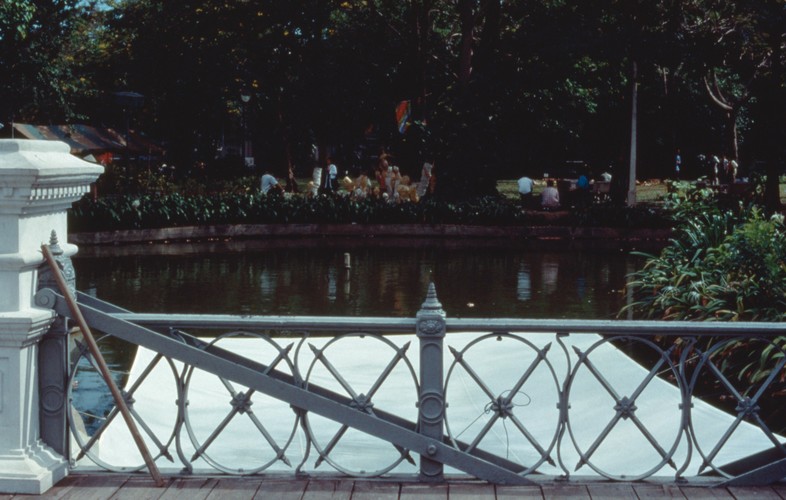 fabric screen suspended over body of water