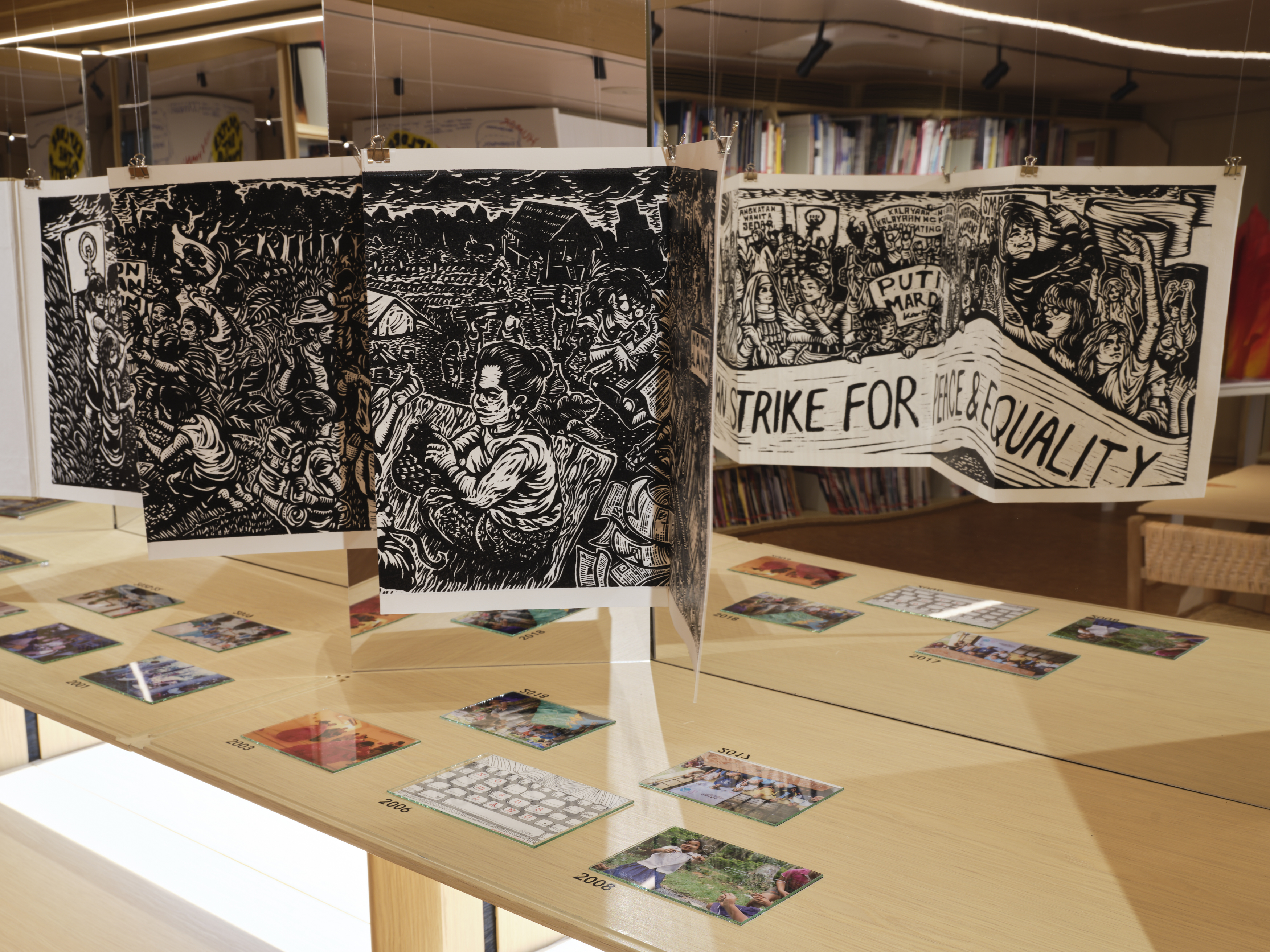 Image: Salikhain Kolektib, Manifesting (In)constancy, 2022, mixed-media installation; Pangrok Sulap, The Flower of the Nation, 2022, woodblock print book. Part of The Collective School, AAA Library, 2022. Photo: South Ho.