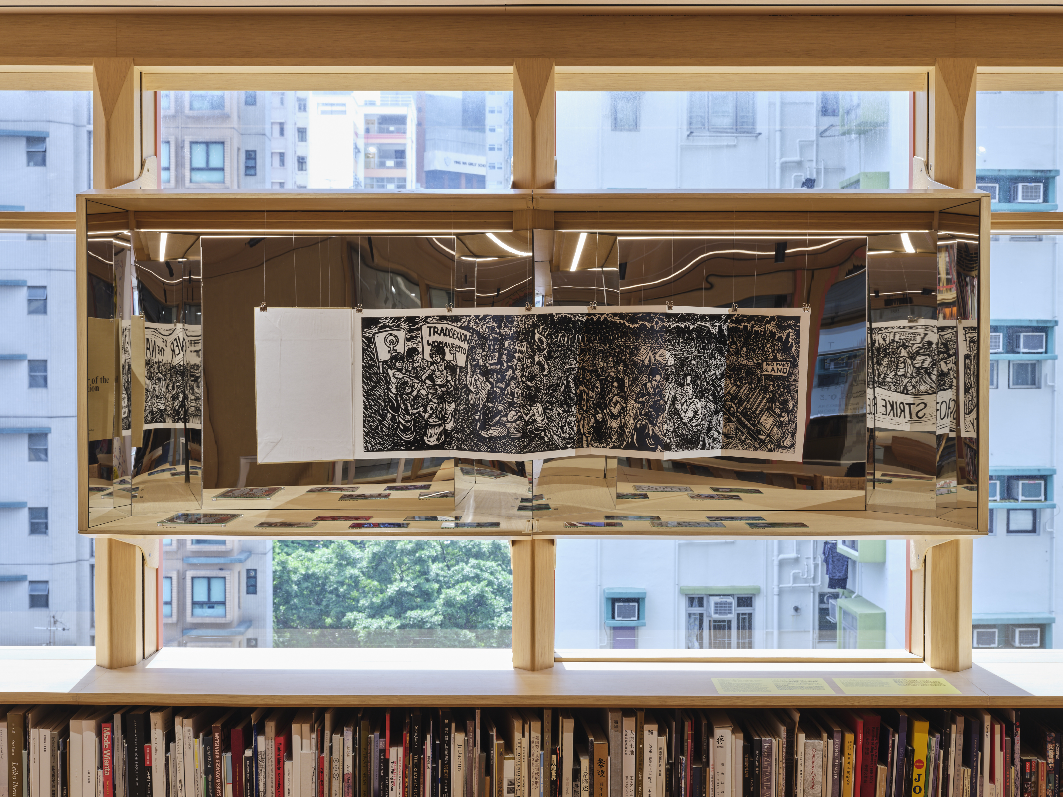 Image: Salikhain Kolektib, Manifesting (In)constancy, 2022, mixed-media installation; Pangrok Sulap, The Flower of the Nation, 2022, woodblock print book. Part of The Collective School, AAA Library, 2022. Photo: South Ho.