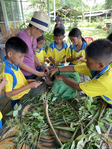 Clay leave workshop with elementary students at Baan Womanifesto